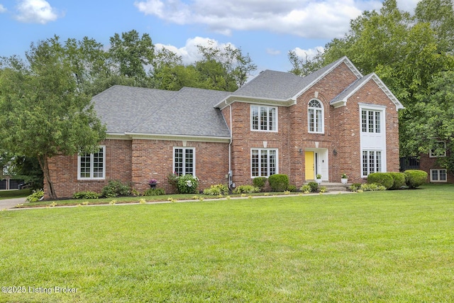 7005 New Bern Ct, Prospect, KY 40059 - view of front of house with brick siding, a shingled roof, and a front yard