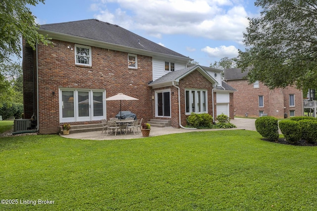 7005 New Bern Ct, Prospect, KY 40059 - back of property featuring entry steps, a lawn, a garage, and brick siding