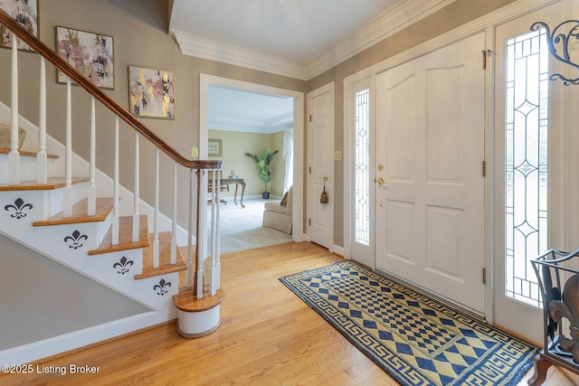 7005 New Bern Ct, Prospect, KY 40059 - foyer with wood finished floors, stairway, and crown molding