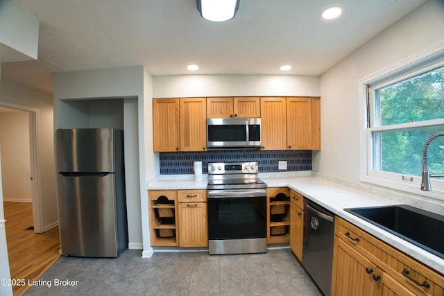 1397 Dotland Cir, Shelbyville, KY 40065 - kitchen featuring stainless steel appliances, tasteful backsplash, light countertops, recessed lighting, and brown cabinetry