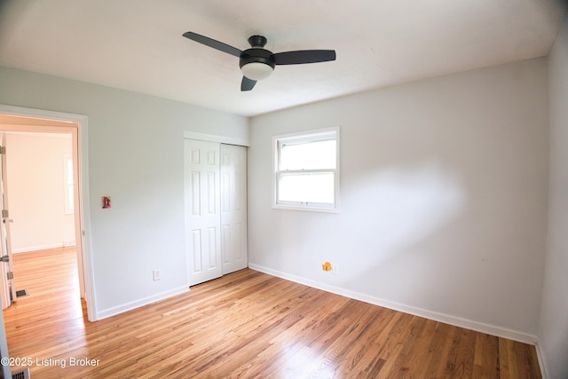 1397 Dotland Cir, Shelbyville, KY 40065 - unfurnished bedroom featuring light wood-style flooring, a closet, and a ceiling fan