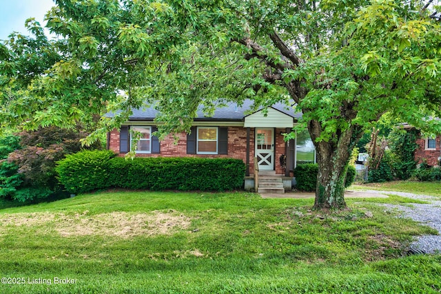 1397 Dotland Cir, Shelbyville, KY 40065 - view of front of house featuring a front lawn, brick siding, and a shingled roof