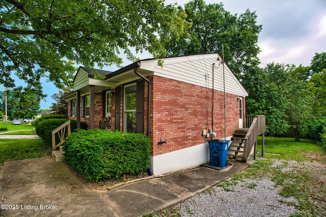 1397 Dotland Cir, Shelbyville, KY 40065 - view of side of property featuring brick siding, a lawn, and stairs