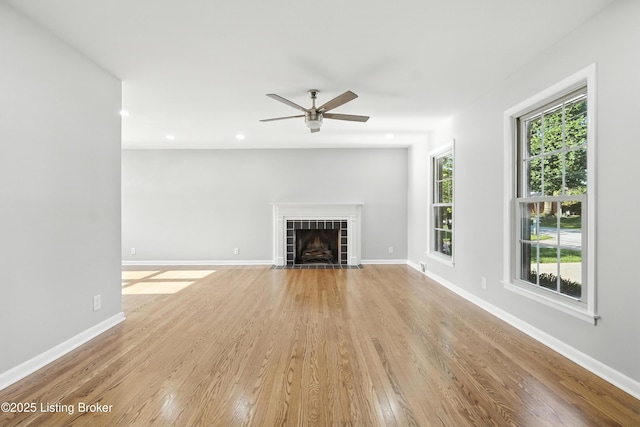 6505 Ridge Cliff Rd, Hollow Creek, KY 40228 - unfurnished living room with light wood finished floors, a ceiling fan, a fireplace, and recessed lighting