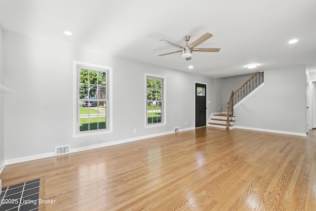 6505 Ridge Cliff Rd, Hollow Creek, KY 40228 - unfurnished living room featuring a ceiling fan, stairs, light wood-style floors, and recessed lighting