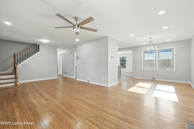 6505 Ridge Cliff Rd, Hollow Creek, KY 40228 - unfurnished living room with a ceiling fan, recessed lighting, light wood-style floors, and stairs