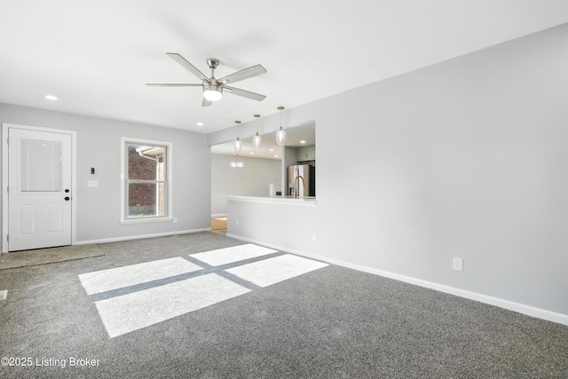 6505 Ridge Cliff Rd, Hollow Creek, KY 40228 - unfurnished living room featuring carpet flooring, a ceiling fan, and recessed lighting