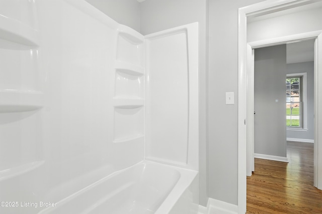 6505 Ridge Cliff Rd, Hollow Creek, KY 40228 - bathroom with wood finished floors and shower / washtub combination
