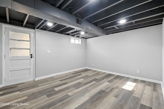 6505 Ridge Cliff Rd, Hollow Creek, KY 40228 - below grade area with wood finished floors and baseboards