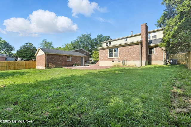 6505 Ridge Cliff Rd, Hollow Creek, KY 40228 - rear view of property featuring brick siding, a fenced backyard, a chimney, and an outdoor structure