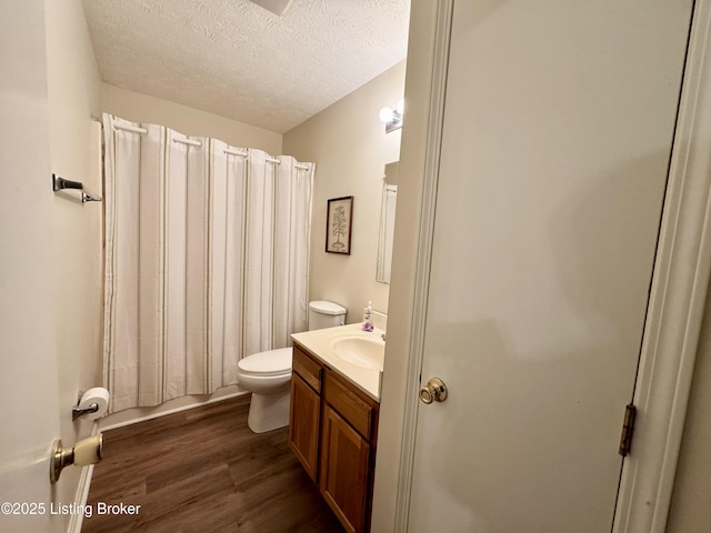 796 Lake Forest Ln, Westview, KY 40178 - bathroom featuring vanity, a textured ceiling, wood finished floors, and shower / tub combo