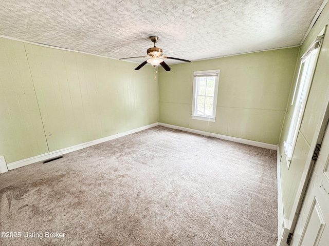 108 Bruce St, Lebanon Junction, KY 40150 - carpeted spare room with a ceiling fan, a textured ceiling, and wood walls