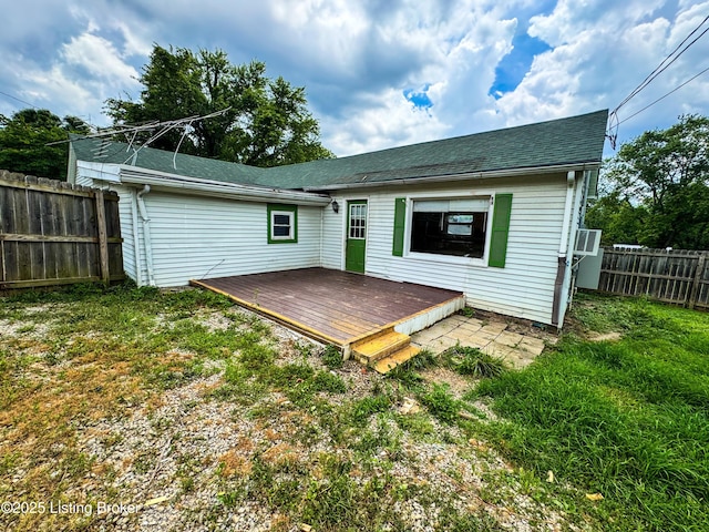 108 Bruce St, Lebanon Junction, KY 40150 - rear view of house featuring a fenced backyard, a wooden deck, and a shingled roof