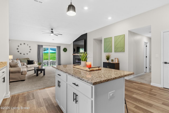 3001 Opal Dr, Shelbyville, KY 40065 - kitchen featuring ceiling fan, light wood-style flooring, a center island, open floor plan, and lofted ceiling