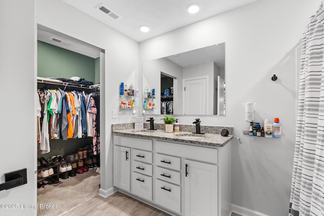 3001 Opal Dr, Shelbyville, KY 40065 - full bath featuring double vanity, a walk in closet, and wood finished floors