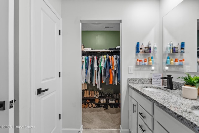 3001 Opal Dr, Shelbyville, KY 40065 - bathroom featuring double vanity and a walk in closet