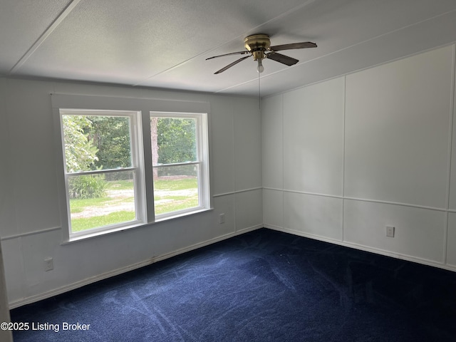 140 Bluegrass Dr, Taylorsville, KY 40071 - spare room featuring a ceiling fan and dark carpet