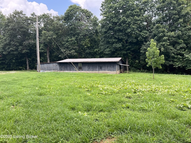140 Bluegrass Dr, Taylorsville, KY 40071 - view of grassy yard with a pole building and an outbuilding