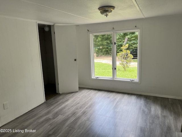 140 Bluegrass Dr, Taylorsville, KY 40071 - spare room featuring wood finished floors and baseboards