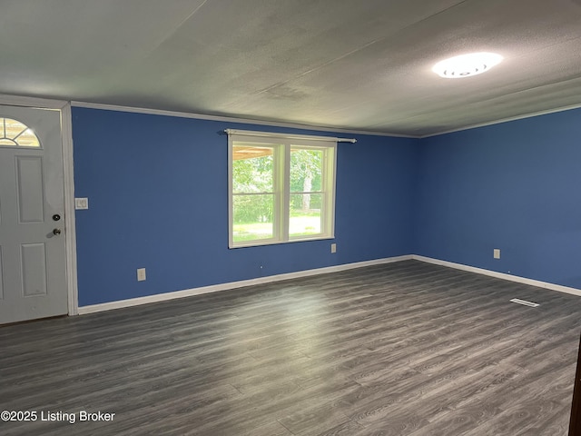 140 Bluegrass Dr, Taylorsville, KY 40071 - spare room with dark wood-style flooring, a textured ceiling, and crown molding