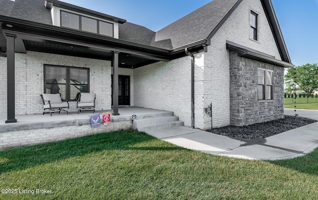 121 Liam Ct, Shepherdsville, KY 40165 - view of front of home featuring covered porch, a front yard, roof with shingles, and brick siding