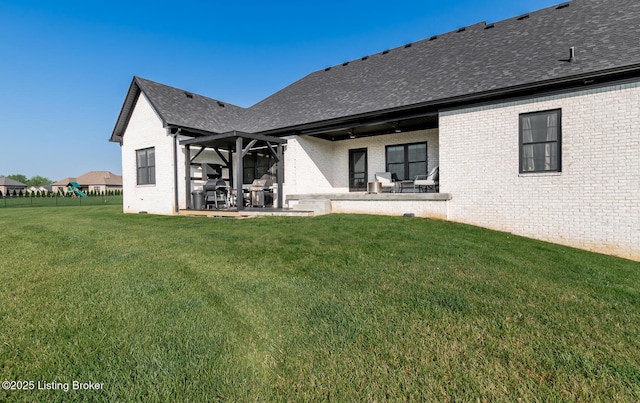 121 Liam Ct, Shepherdsville, KY 40165 - back of property with brick siding, a shingled roof, and a patio