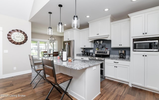 121 Liam Ct, Shepherdsville, KY 40165 - kitchen with stainless steel appliances, recessed lighting, a kitchen island, dark wood-style floors, and white cabinets
