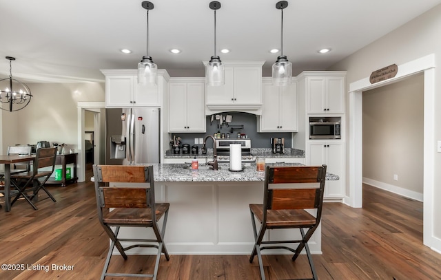 121 Liam Ct, Shepherdsville, KY 40165 - kitchen with stainless steel appliances, a kitchen bar, dark wood-type flooring, and recessed lighting
