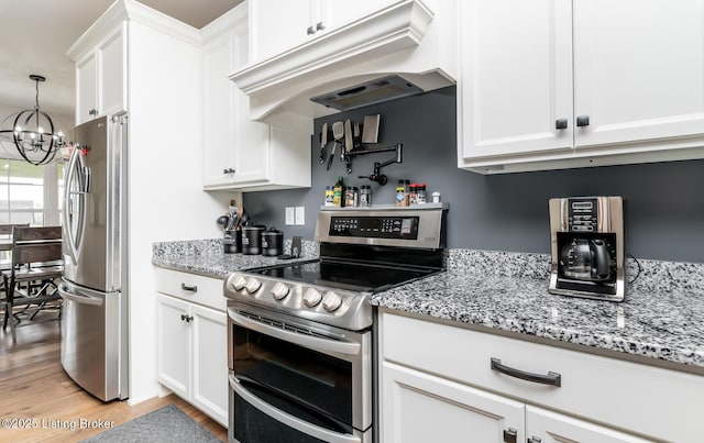 121 Liam Ct, Shepherdsville, KY 40165 - kitchen featuring appliances with stainless steel finishes, under cabinet range hood, a chandelier, light wood-type flooring, and white cabinetry