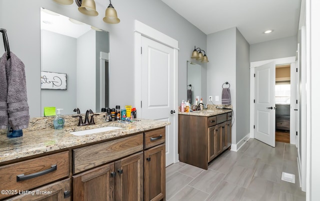 121 Liam Ct, Shepherdsville, KY 40165 - full bathroom featuring two vanities and baseboards