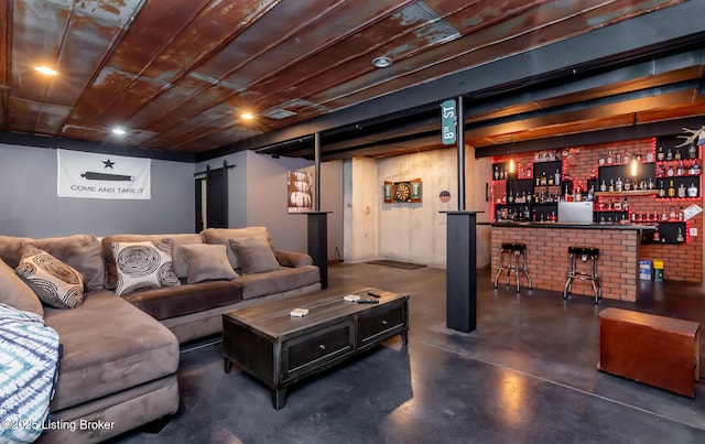 121 Liam Ct, Shepherdsville, KY 40165 - living area featuring finished concrete floors and a bar