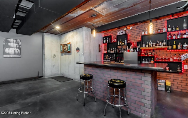 121 Liam Ct, Shepherdsville, KY 40165 - indoor dry bar featuring finished concrete flooring and brick wall