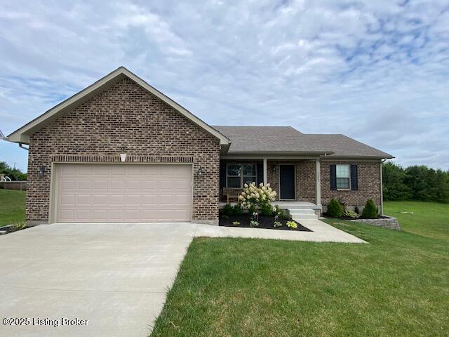 121 Redwood Dr, Bardstown, KY 40004 - ranch-style home featuring driveway, brick siding, a garage, and a front lawn