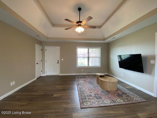 121 Redwood Dr, Bardstown, KY 40004 - unfurnished living room with a tray ceiling, wood finished floors, and ceiling fan