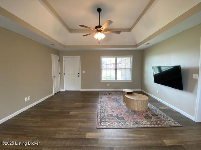 121 Redwood Dr, Bardstown, KY 40004 - unfurnished living room featuring a tray ceiling, wood finished floors, and ceiling fan