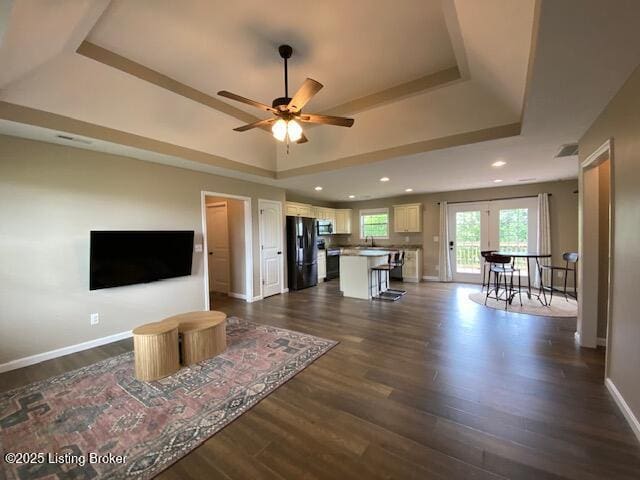121 Redwood Dr, Bardstown, KY 40004 - living area featuring a raised ceiling, dark wood-type flooring, ceiling fan, and recessed lighting