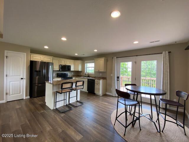 121 Redwood Dr, Bardstown, KY 40004 - kitchen with black appliances, a kitchen island, recessed lighting, dark wood-style floors, and white cabinets