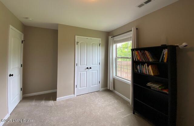 121 Redwood Dr, Bardstown, KY 40004 - unfurnished bedroom featuring light colored carpet and a closet