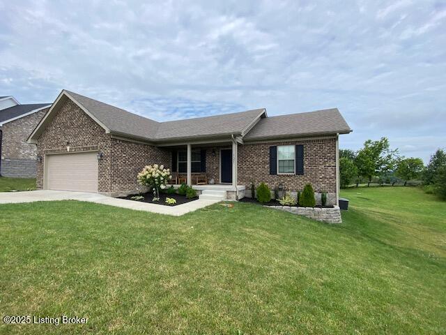 121 Redwood Dr, Bardstown, KY 40004 - ranch-style house with a garage, brick siding, concrete driveway, and a front lawn