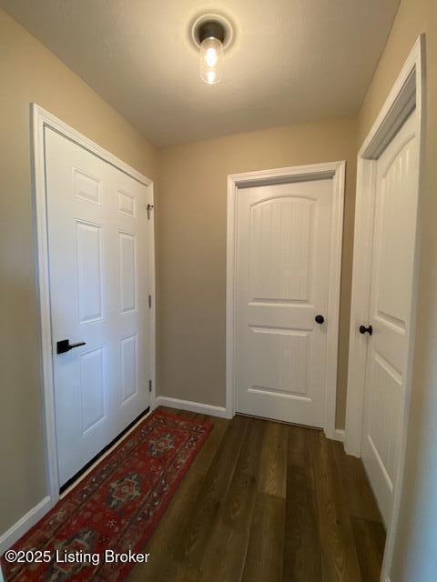 121 Redwood Dr, Bardstown, KY 40004 - corridor with dark wood-type flooring and baseboards