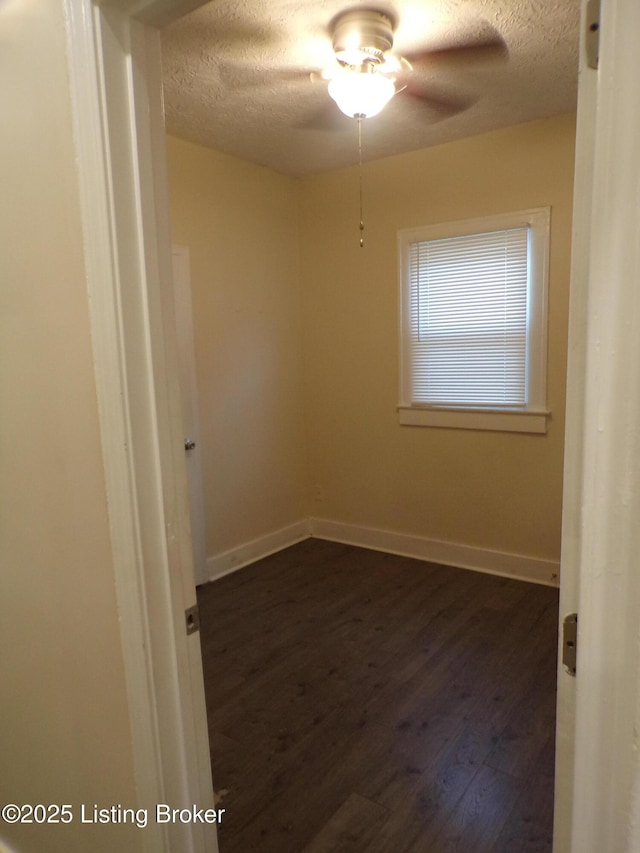 2113 Dumesnil St, Louisville, KY 40210 - unfurnished room featuring a textured ceiling, dark wood-style floors, and ceiling fan