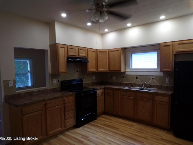 2113 Dumesnil St, Louisville, KY 40210 - kitchen featuring black appliances, ventilation hood, dark countertops, decorative backsplash, and recessed lighting