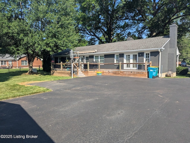 7206 Arrowwood Rd, Louisville, KY 40222 - view of front of house featuring a deck, a chimney, brick siding, and a shingled roof