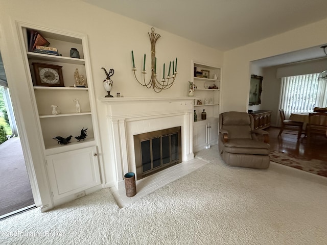 7206 Arrowwood Rd, Louisville, KY 40222 - living room with built in features, carpet, plenty of natural light, and a fireplace with flush hearth