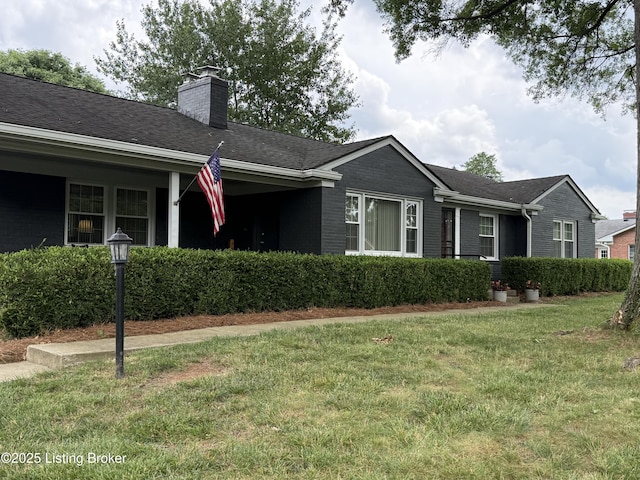 7206 Arrowwood Rd, Louisville, KY 40222 - view of front facade featuring a chimney, a front yard, brick siding, and roof with shingles