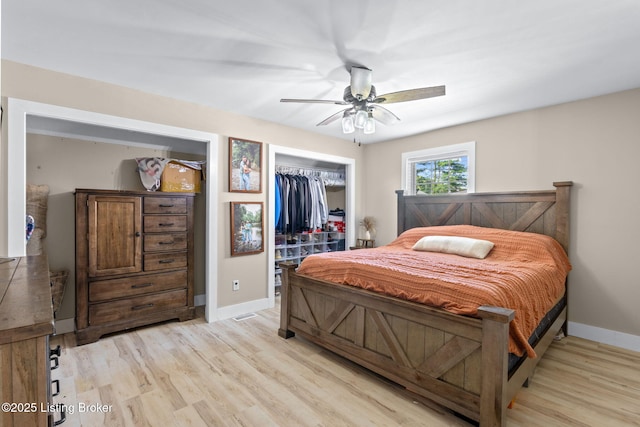 508 Auburn Oaks Dr, Louisville, KY 40214 - bedroom featuring light wood-style floors, a closet, a spacious closet, and ceiling fan