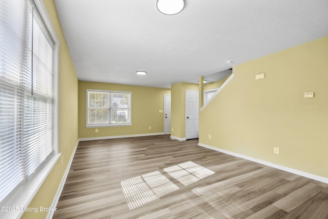 1601 Wilson Ave, Louisville, KY 40210 - unfurnished living room with wood finished floors and recessed lighting