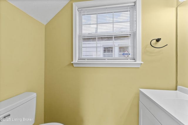 1601 Wilson Ave, Louisville, KY 40210 - half bathroom featuring vanity and vaulted ceiling