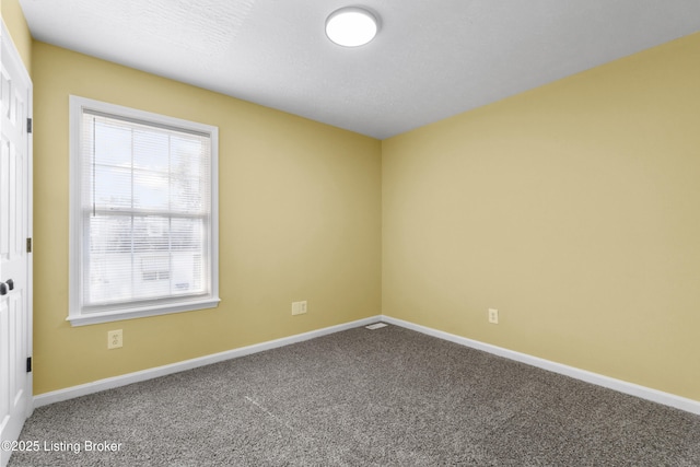 1601 Wilson Ave, Louisville, KY 40210 - carpeted empty room featuring baseboards