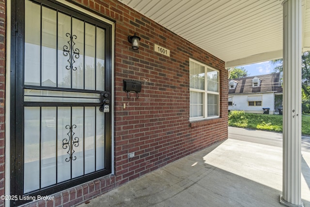 1601 Wilson Ave, Louisville, KY 40210 - doorway to property with a porch and brick siding